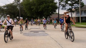 Cyclists ride through the Lake Terrace neighborhood of New Orleans en route from the London Avenue Canal breach to the 17th Street Canal breach.  Photo/Hubie Vigreux